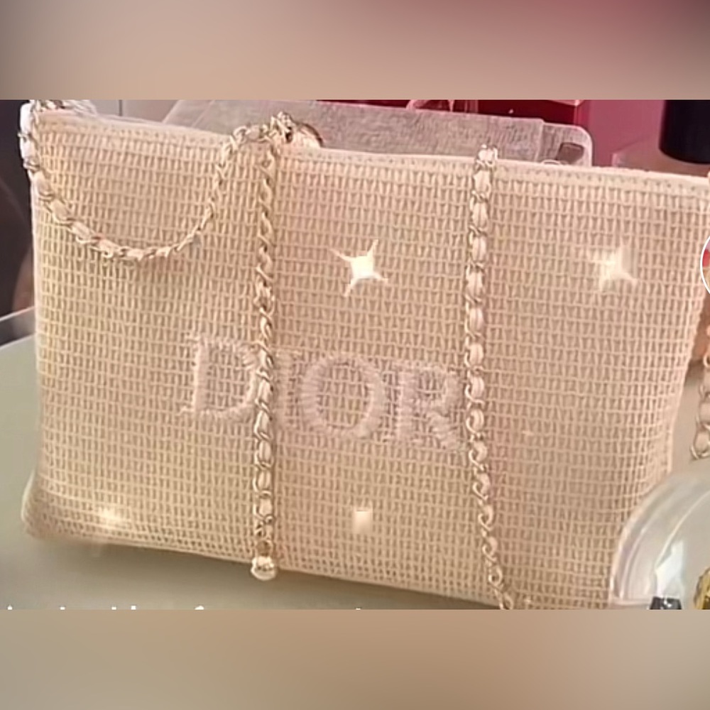 Dior pouch. Beautiful you can make it into a purse They sell the chain at Amazon